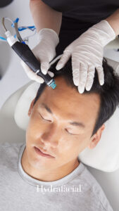 Male receiving HydraFacial treatment in Victoria BC at Olakino Laser + Skin